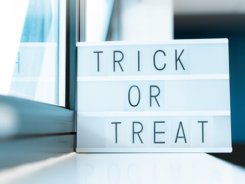 A light box with trick or treat on it